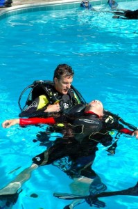 Rescue divers practicing how to respond to a scuba emergency: assisting an unresponsive, non-breathing diver at the surface.  