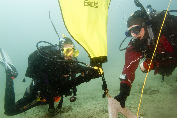 Search and Recovery divers using a lift bag to raise an object as part of their track towards Master Scuba Diver