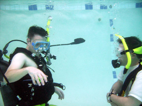 Open Water scuba student practicing skills with an open water scuba instructor