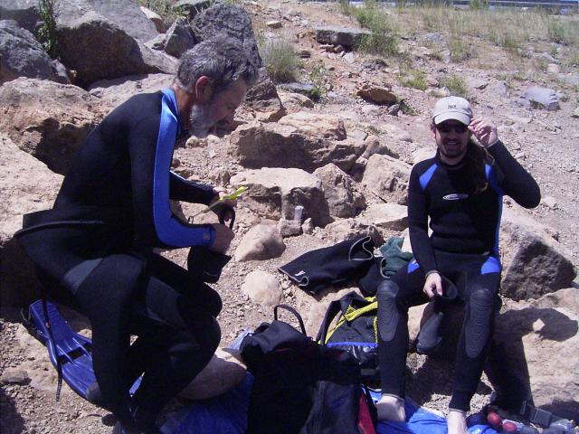 divers getting ready for diving in a high mountain lake; they should have extra emergency oxygen because of their remoteness