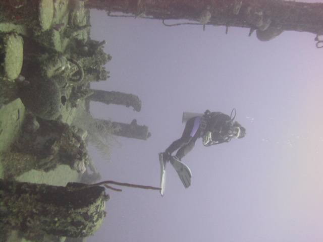 Hovering scuba diver, weightless above a wreck