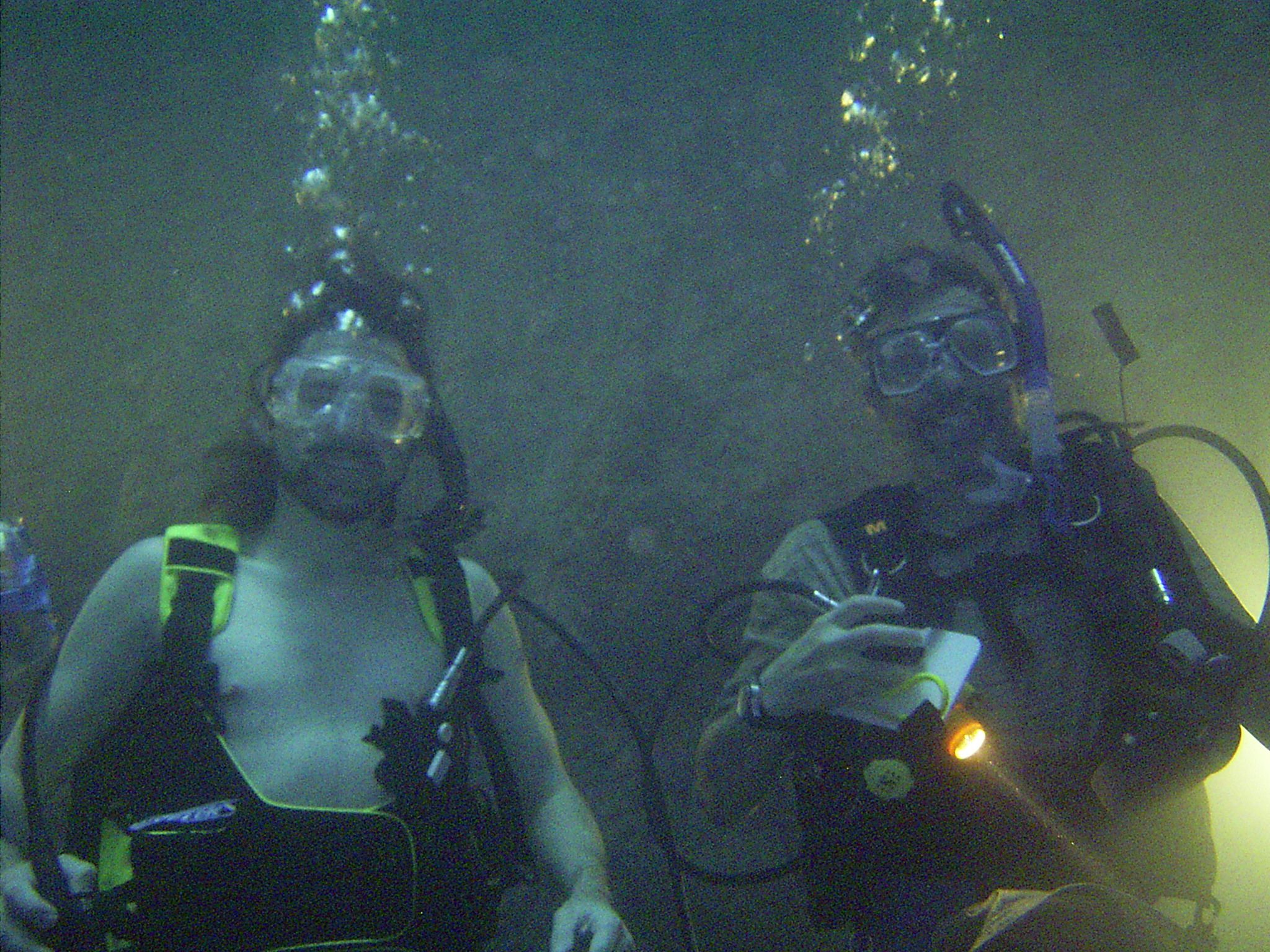 Two scuba divers enjoying the Hot Spring Diver experience at the Homestead Crater